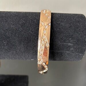 Gold tone rhinestone bangle
